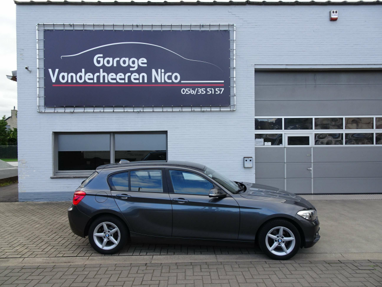 BMW 118 118i 5d. NAVI,PDC V+A,BLUETH,AIRCO,USB,ALU,SERVO Garage Nico Vanderheeren BV